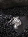 Macro shot of a silver turtle ring with white inlay on a dark natural stone base - Turtle Style (NR296)