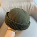 Detail of army green docker cap featuring canvas top and thick knit rolled brim - Adjustable / Army Green Knit Edge Skull Cap