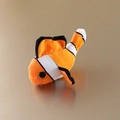 Plush clownfish refrigerator magnet made of soft fabric in bright orange and white - Clownfish