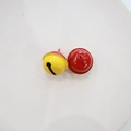 Detailed macro view of 2.2cm yellow and red bicolor painted metal DIY craft bells - Yellow Red