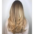 Long blonde wavy layered synthetic wig for women with a natural gradient back view - Gold