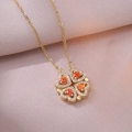 Collier trèfle à quatre feuilles doré avec zircons rouges et cristaux étincelants - Collier En Acier X1205