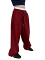Detail of dark red textured fabric and elastic drawstring waistband on wide-leg joggers - Burgundy