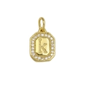 Macro view of gold 18k octagonal pendant featuring crystal inlay and letter K design - Gold Letter K