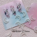 Detailed macro view of white resin pearl moon nail charms, size 12x15mm, model YD-605 - Moon