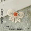 Lace bow applique with orange button 3.8x2.9cm for DIY hair accessories - Bow