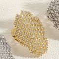 Macro view of gold and silver geometric open rings with sparkling cubic zirconia pavé - Long Zirconia Style / Gold