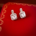 Macro shot of silver halo stud earrings with square brilliant zircon in a red gift box - Square Zirconia Studs / Silver