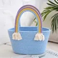 Detailed macro view of light blue woven cotton bag with rainbow handle and tassel decoration - Sky Blue