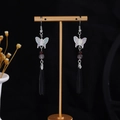 Iridescent butterfly drop earrings with black waterdrop pendants on a gold display stand - E3449-2 (Silver Butterfly Long Water Drop)