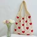 Knitted tote bag with red heart patterns and diamond checks on a cream background - Apricot and Red
