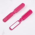 Mini rose red foldable hairbrush with integrated mirror in open and closed views - Rose Red
