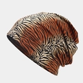 Detailed view of the tiger print slouchy beanie featuring vibrant knit texture and drapes - Pattern 2-Tiger Print Style