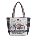 Ethnic woven tote bag featuring colorful Penang street art and landmark embroidery - Bicycle