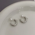 Elegant silver C-shaped hoop earrings featuring white pearls on a minimalist ceramic tray - Plain Silver C-Shaped Pearl Studs