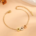 Three-tone stainless steel rings on a fine chain bracelet with S.STEEL material tag - Tri-Color Circular Ring Bracelet (I717)