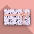 Purple gift wrapping paper with cartoon cat patterns and a pink satin ribbon bow - Style 9 (Lavender Cat Prints)