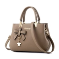 Taupe pebbled leather tote bag with bow detail and gold star charm for women - Brown