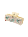 Macro detail of beige PU hair claw clip with Christmas holly and festive text design - Merry Christmas Beige