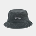 Macro shot of embroidered white NEWYORK logo on dark grey washed cotton bucket hat - One Size / Army Green