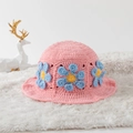 Detail of pink hand-knitted hollow bucket hat with blue floral daisy crochet accents - One Size / Blue Daisy Pink Base
