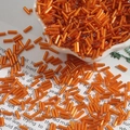 Metallic orange 2x7mm silver-lined glass bugle beads for DIY jewelry and sewing - Diameter approx 2mm x Length approx 7mm 15g/Pack Approx 300 Pieces / Orange Red
