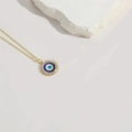 Golden evil eye sunburst pendant necklace with colorful enamel and white zircon accents - Purple Evil Eye