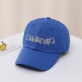 Close-up of kids navy baseball cap featuring detailed construction truck embroidery - 54cm / Blue