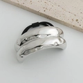 Silver liquid metal texture ponytail holder with black elastic hair tie on a stone tile - Silver Textured Wide Hair Rope