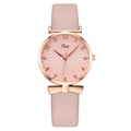 Elegant pink quartz watch for women with rose gold details and leather strap on white - Pink