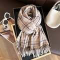 Classic beige checkered cashmere-feel scarf with tassels styled on a brown leather surface - Beige & Blue Plaid (WT152-3)