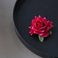 Elegant rose red silk flower hair clip with green leaves on a minimalist black tray - Small Rose / Burgundy