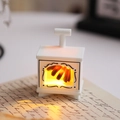 Close-up of white mini retro fireplace LED lantern on handwritten letter with warm glow - Mini Fireplace / White