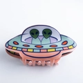 Green and orange UFO alien hair claw clip in a glossy acrylic finish for women - Green and Orange UFO