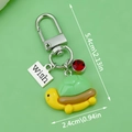 Cartoon turtle keychain pendant in green and yellow with wish tag and size 5.4cm x 2.4cm - Green Resin Turtle