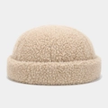 Close-up of thick beige teddy fleece fabric texture on a docker cap brim - Adjustable / Khaki
