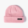 Pink rib-knit beanie hat featuring a black rectangular MTEESX logo patch on the cuff - One Size / Pink