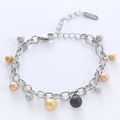 Elegante pulsera de eslabones de acero inoxidable con colgantes de bolas de metal esmerilado - Color Acero