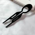 Minimalist black U-shaped acetate hair fork with sleek oval cutout for elegant buns - Solid Black