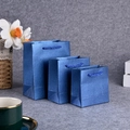 Set of three blue textured paper gift bags with rope handles in small medium large sizes - Pearlescent Sapphire Blue