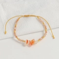 Detail of bohemian agate bead bracelet with adjustable gold cord and natural stones - Orange