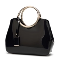 Elegant black patent leather shoulder bag with gold braided ring handles for brides - Black