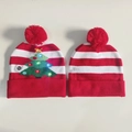 Detail of Christmas knit hats showing the LED light battery switch and knit texture - Christmas Tree Cuff Style-Christmas Hat