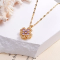 Elegant gold titanium necklace with rotating clover pendant and purple zircon gemstone - Rotating Purple