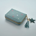 Detail of light blue leather wallet with heart embroidery and tassel zipper charm - Blue