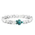 Natural white howlite bead bracelet featuring a turquoise turtle charm on white background - White Turquoise