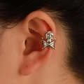 Gothic skull and crossbones ear cuff in vintage silver finish shown on ear - Copper / Skull and Crossbones / Antique Silver