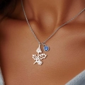 Silver collar necklace featuring a floral pendant with a deep blue round zircon gemstone - December