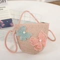 Detail of child straw crossbody bag with delicate butterfly appliques and pearl accents - Pink Bag