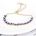 Detail view of the adjustable sliding clasp and golden chain on the Evil Eye beaded bracelet - Dark Blue